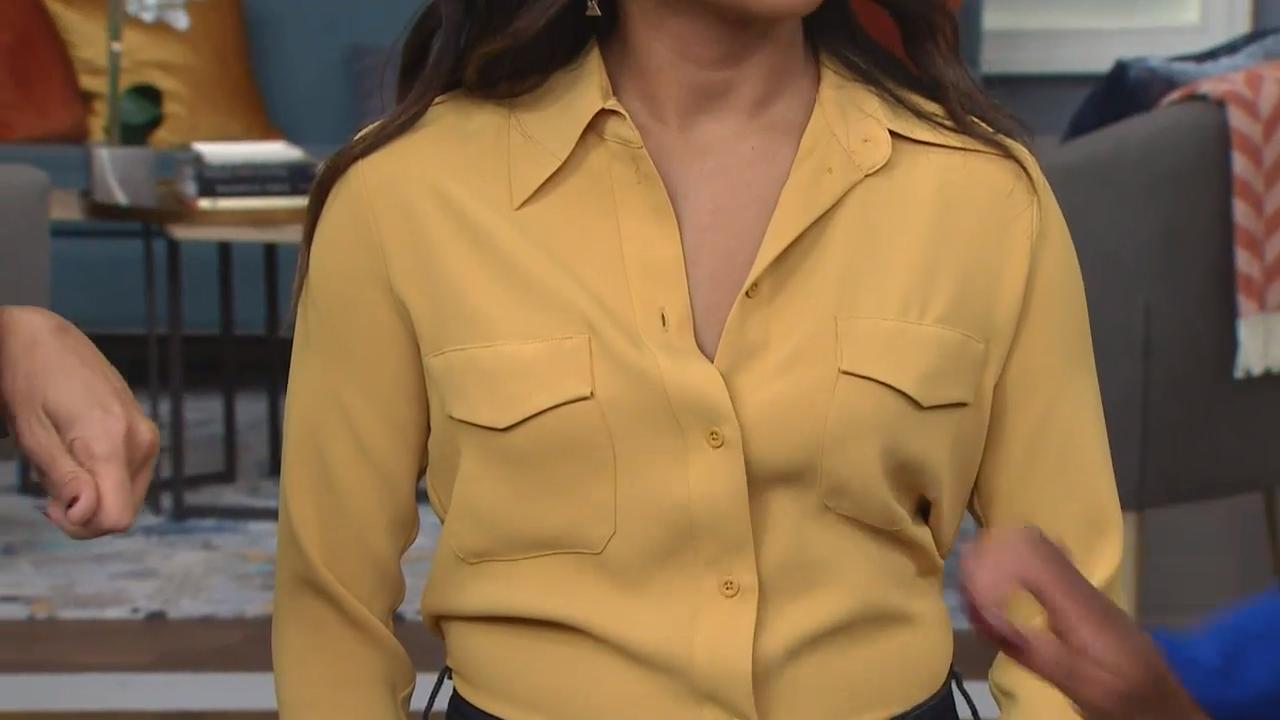 Hold the button down. Buttons pulling on a Blouse. Open buttons Blouse tits. How to position a buttons on the Blouse. Woman believes in her Blouse buttons.